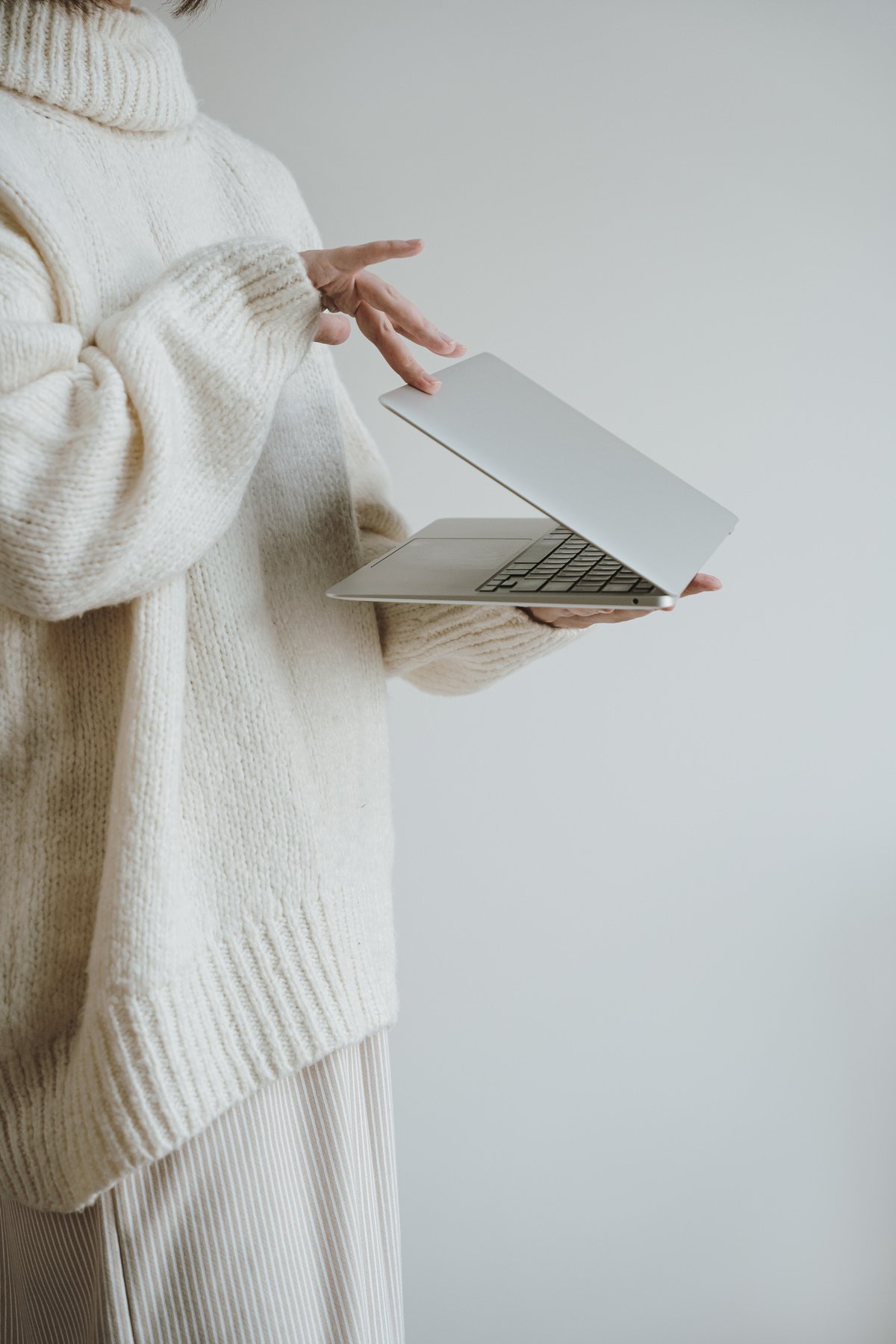 Person Closing Laptop